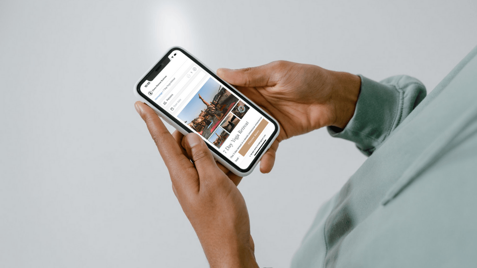 A woman booking a retreat on an iPhone.