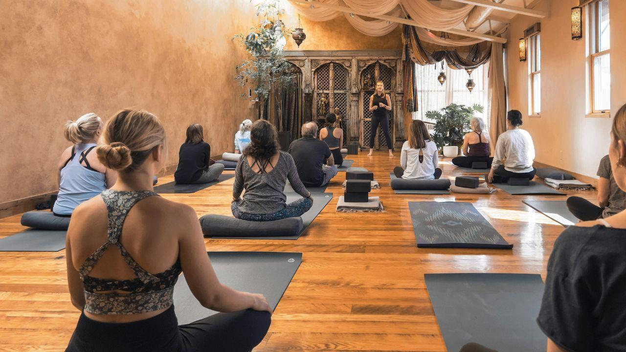 A group session in a women's yoga retreat.