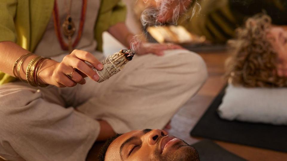 A man experiencing a ceremony at a luxury hotel.