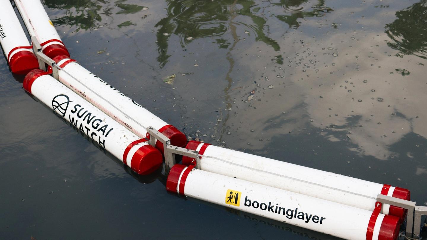 The Sungai Watch and Bookinglayer river barrier in the water.