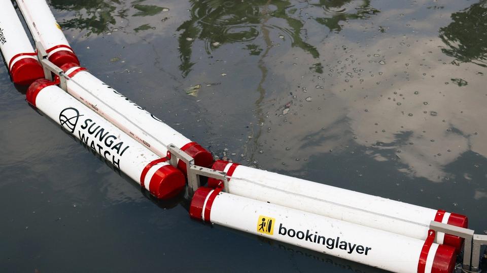 The Sungai Watch and Bookinglayer river barrier in the water.