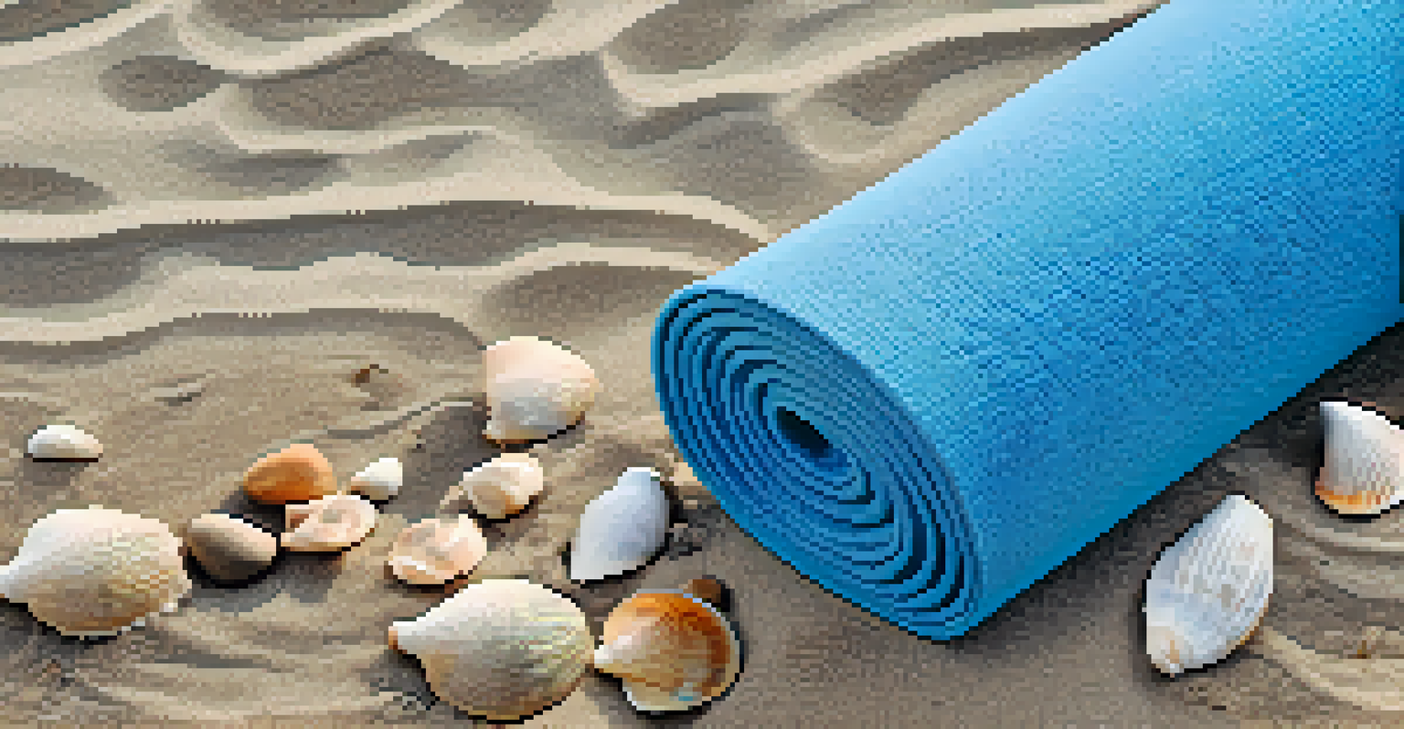 An overhead view of a yoga mat on the beach surrounded by seashells and ocean waves in the background.