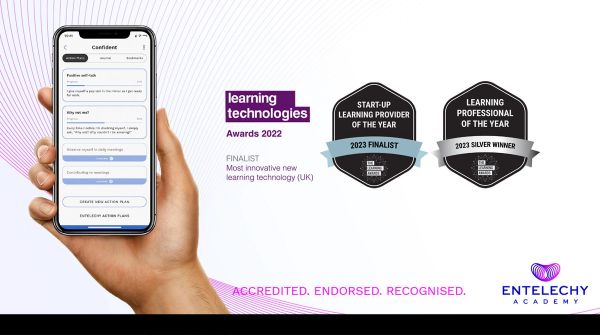 Hand holding a phone showing the Entelechy Academy app with award finalist badges for 2023 finalist for start up learning provider of the year and 2023 silver winner for learning professional of the year