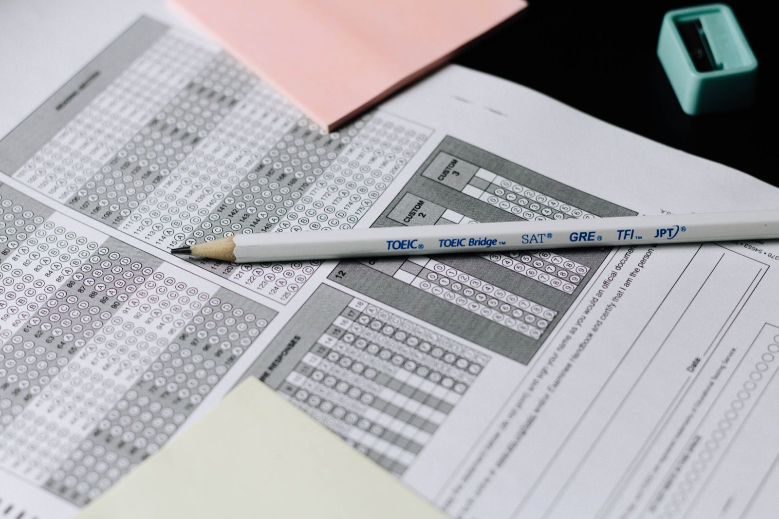 Pencil and sharpener laid down on multiple choice quiz