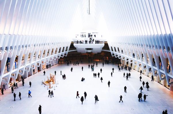 Futuristic building with people walking around inside