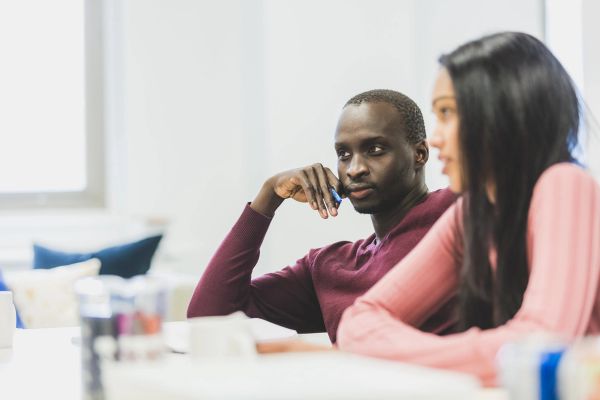 Staff in a Meeting listening to a manager