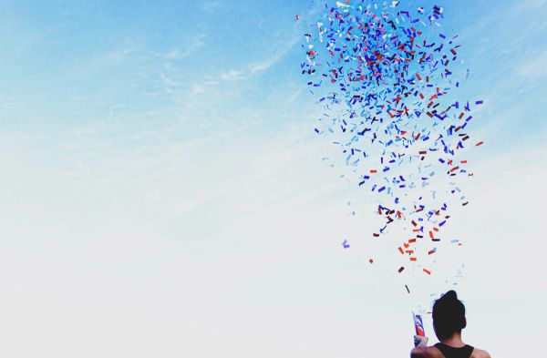 Woman firing confetti into the sky