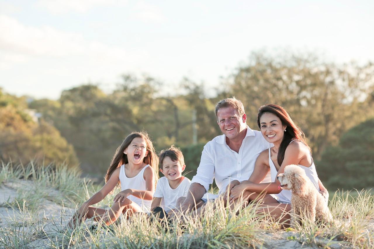 A family sitting together outdoors