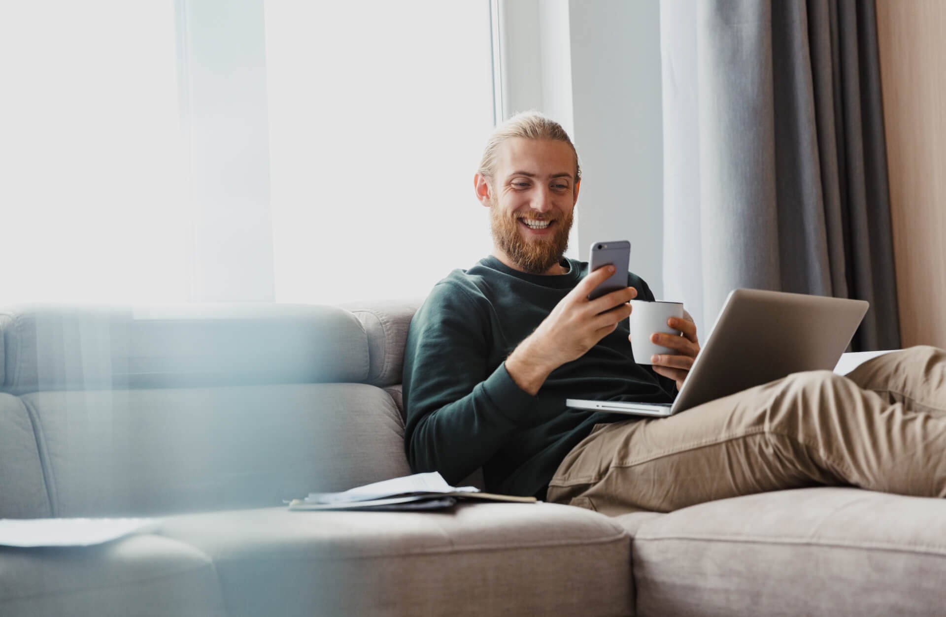 A happy man with a phone in his hand