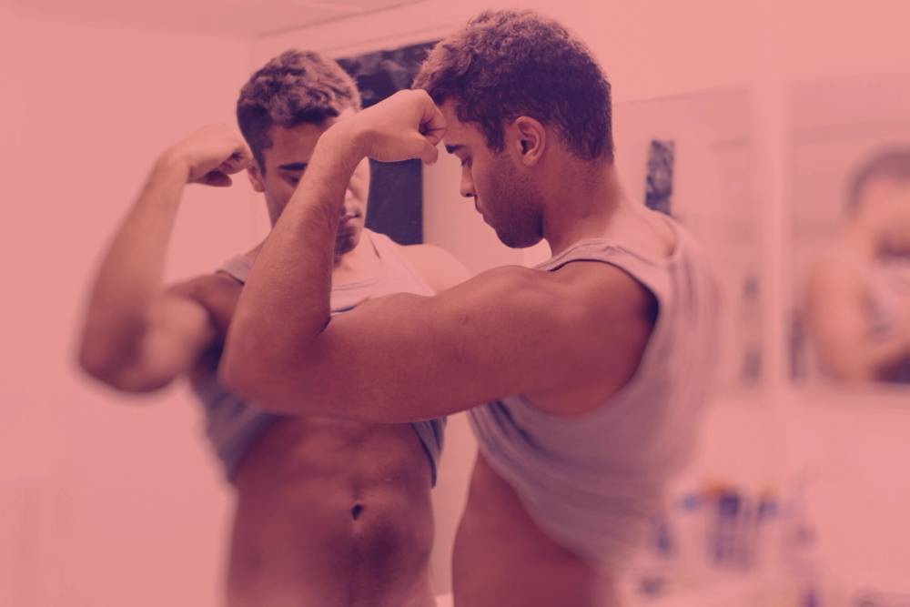 Man looking at muscles