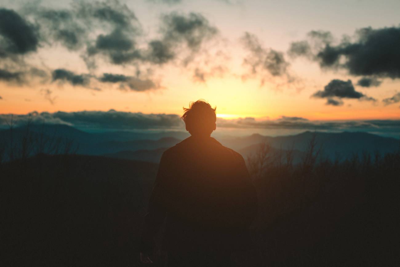 Man staring at sunset