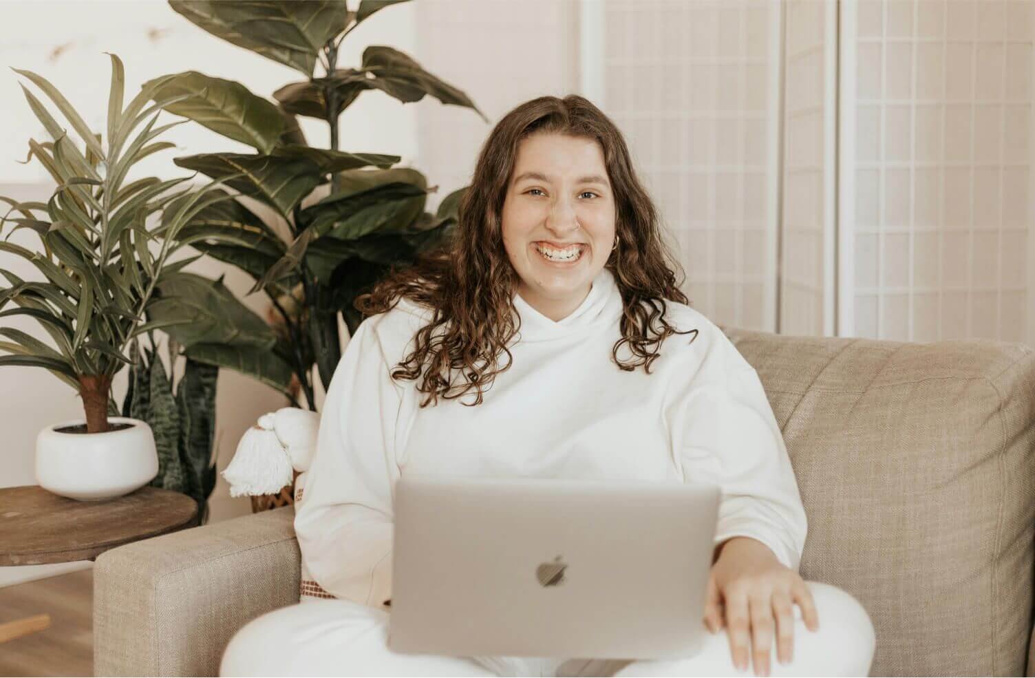 A happy woman with a laptop