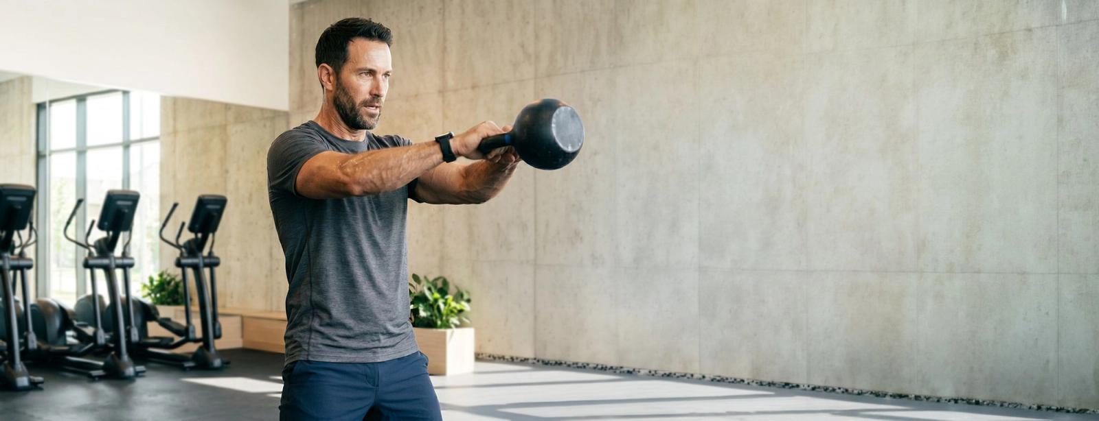 Man working out with kettlebell