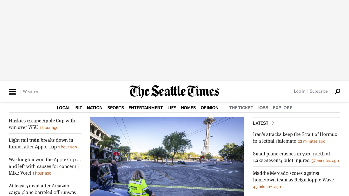 The Seattle Times homepage showing local news headlines, the masthead, and the Log In and Subscribe links