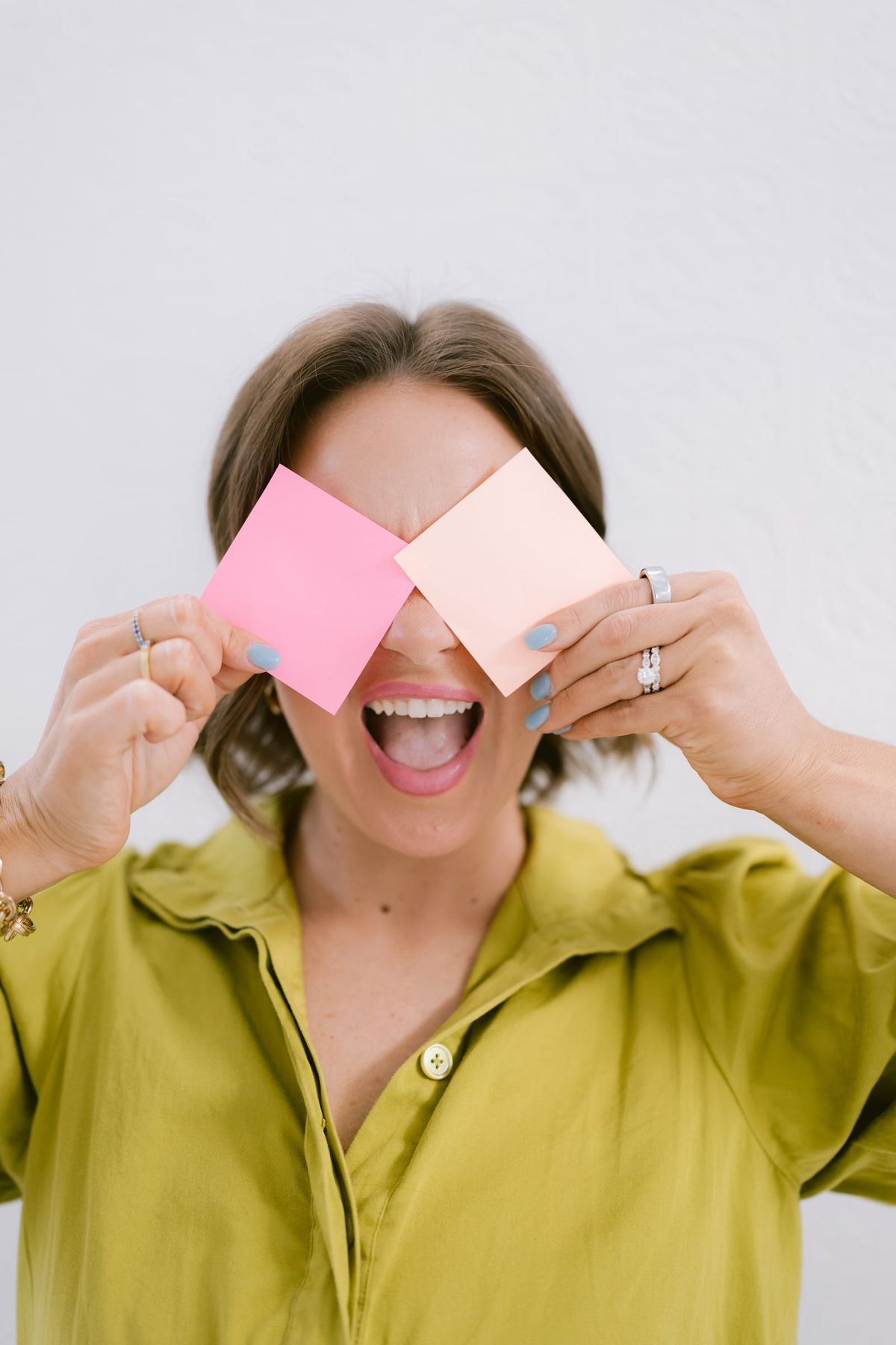 Candace holding sticky notes reading "this could be you" and "you are THAT girl" up to her face