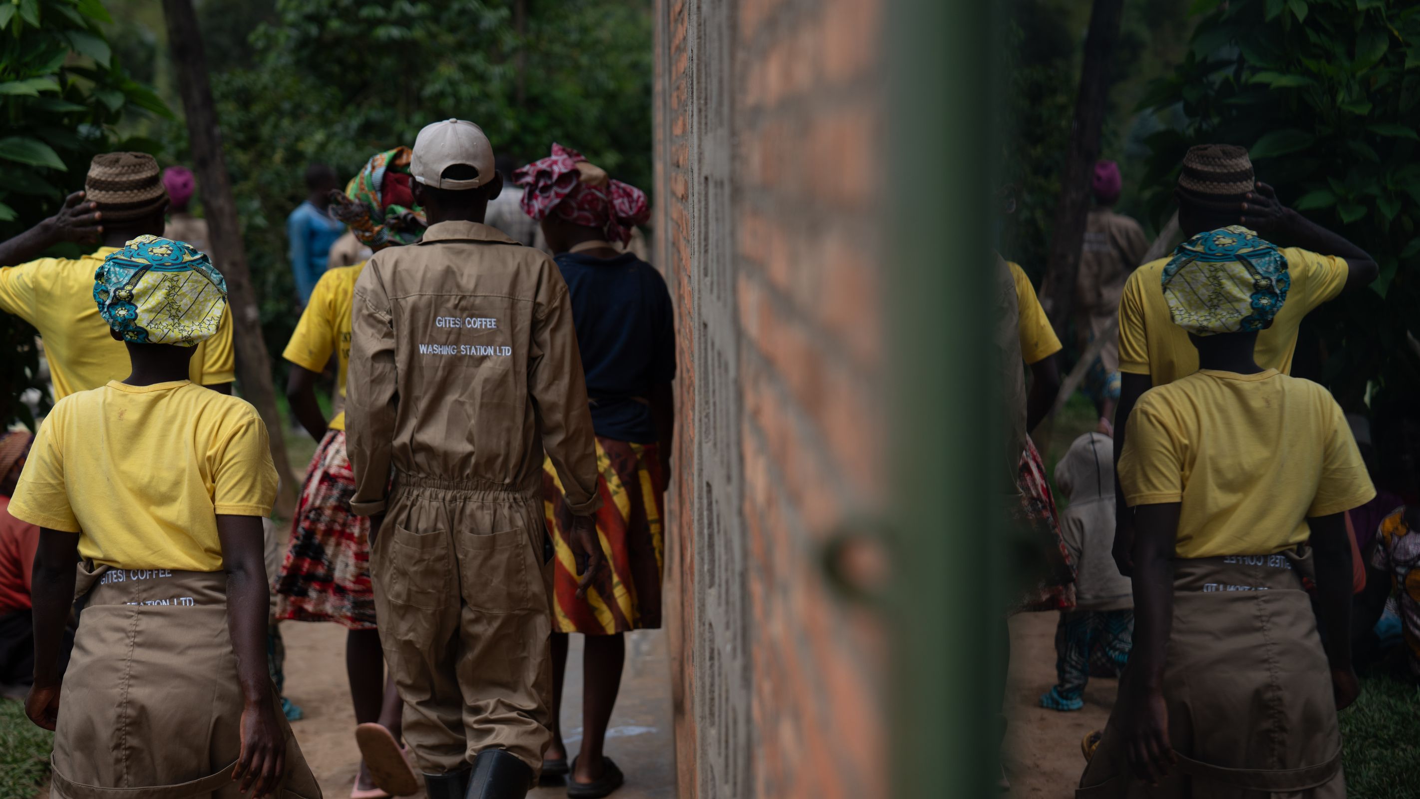 Workers leaving the Gitesi Coffee Washing Station