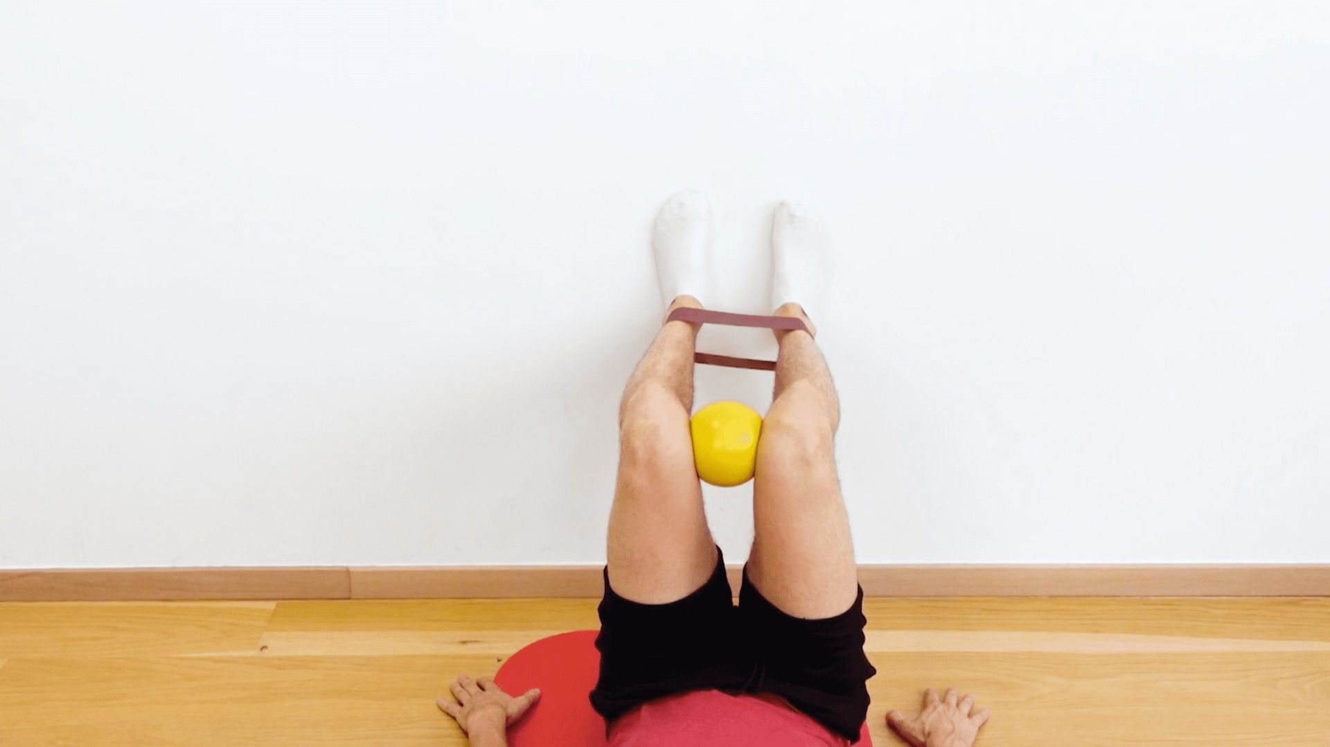 Supine Hip Internal Rotation Strengthening With Elastic Band, view 1