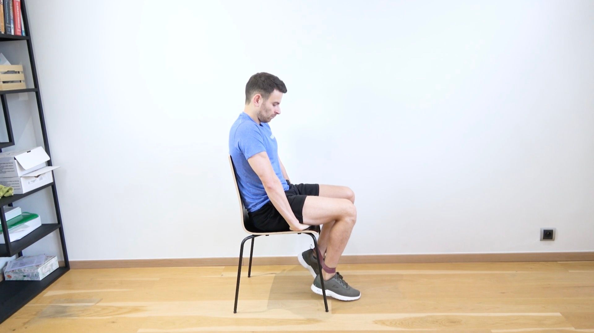 Seated Quadriceps Strengthening With Band Around Ankles, view 1