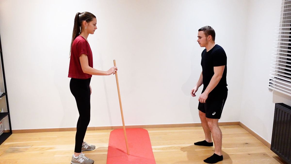 Réception bâton jambes fléchies