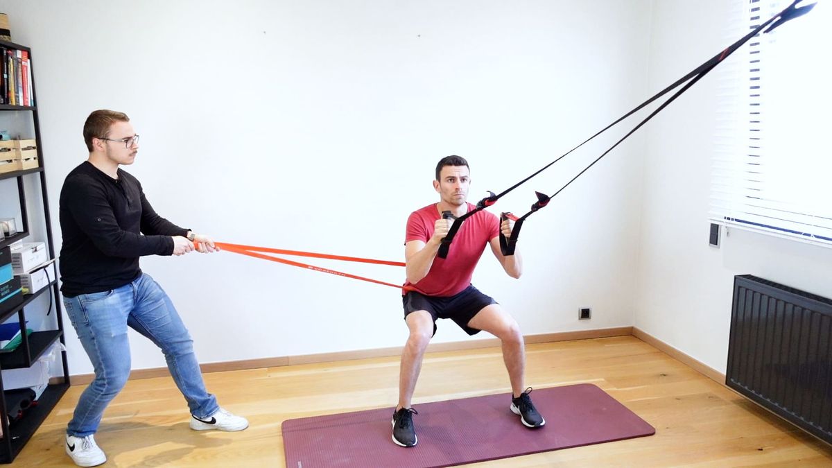 Body-Weight Squat With External Lateral Pull