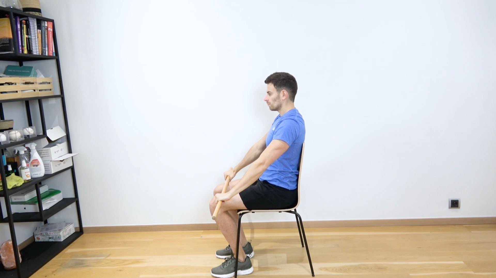 Seated Active-Assisted Shoulder Flexion With Stick, view 1
