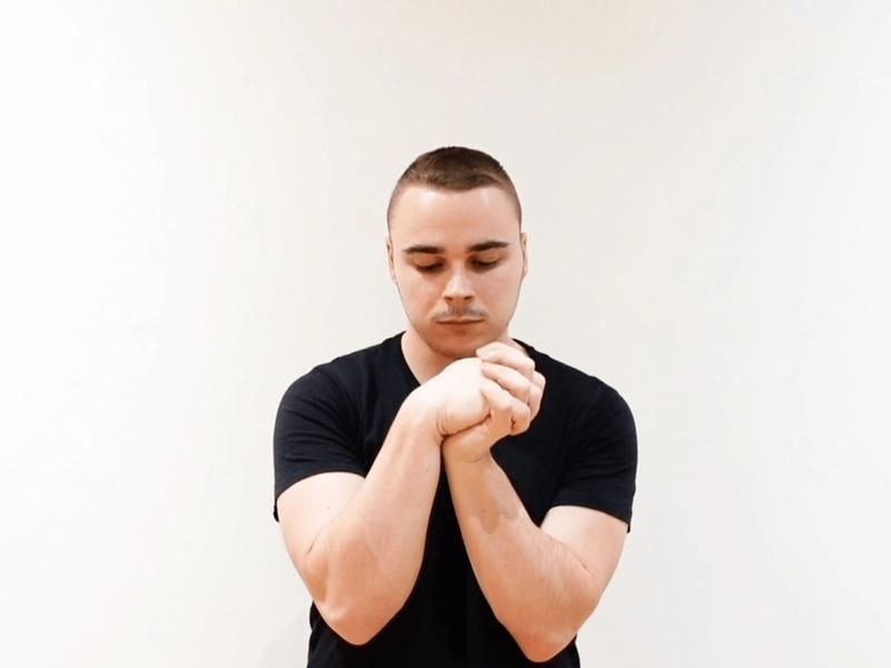 Wrist Flexion / Extension Mobilization With Interlaced Fingers, view 2