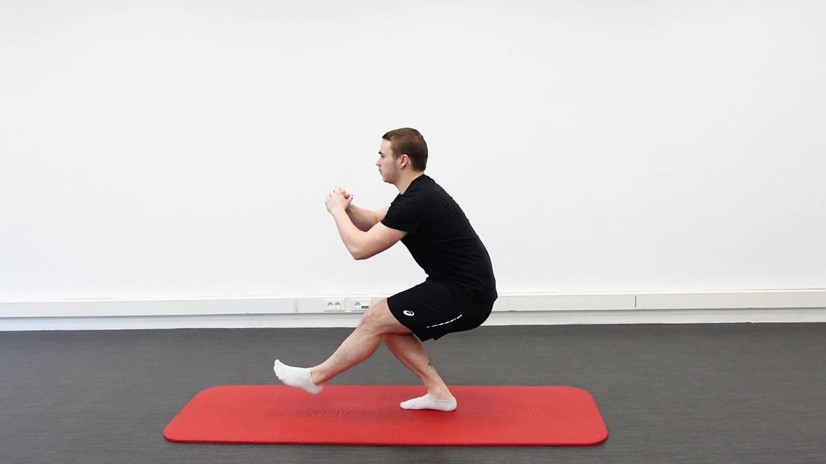 Squat unipodal, jambe libre devant