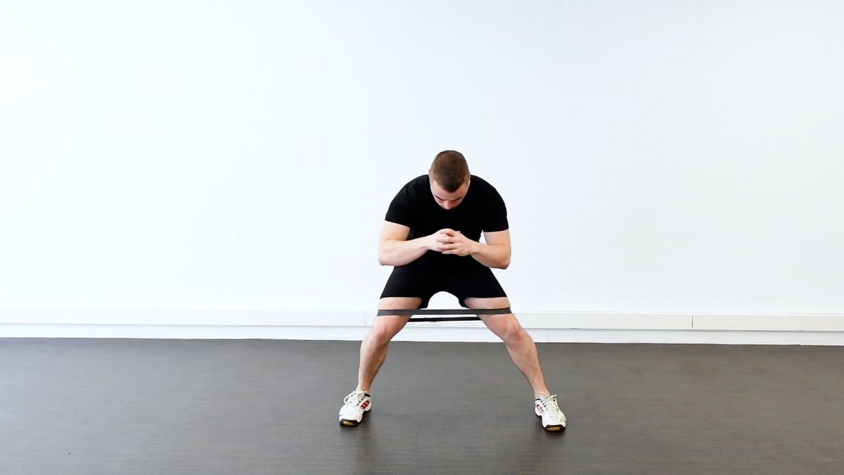 Lateral Steps With Band at Knees