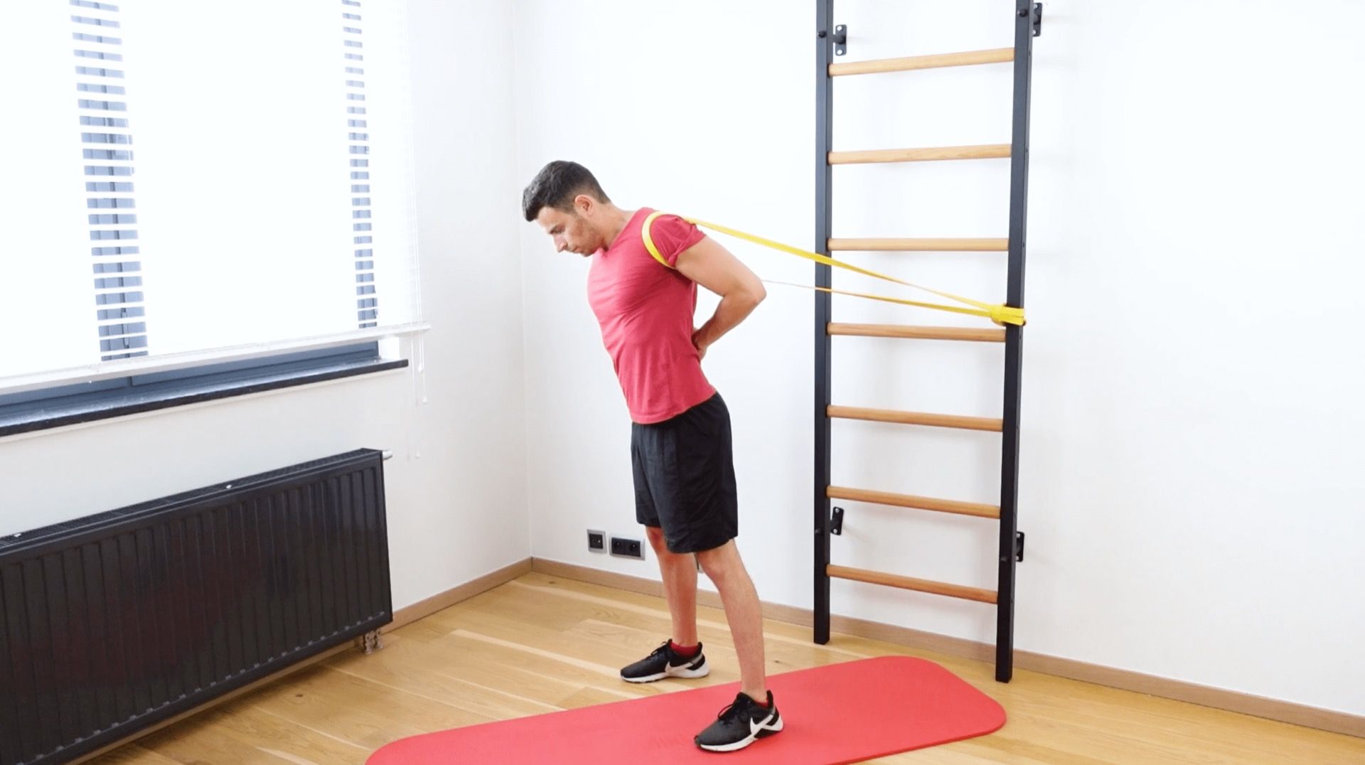 Shoulder Rotation Behind the Head & Back With Elastic Band Rear Traction, view 1
