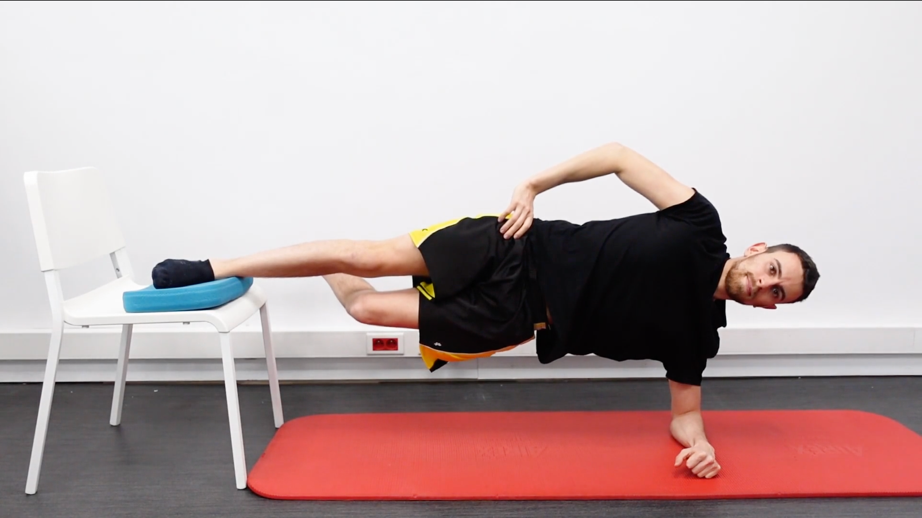 Isometric Side Plank With Foot on Chair and Bottom Knee Bent