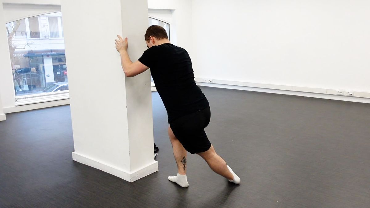 Hip Abductor Stretching Standing at a Wall