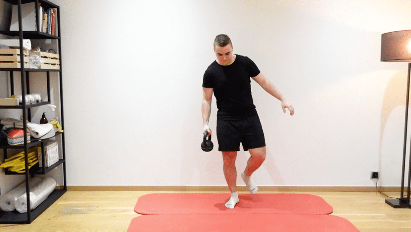 Single-Leg Balance With Kettlebell Transfer, view 2
