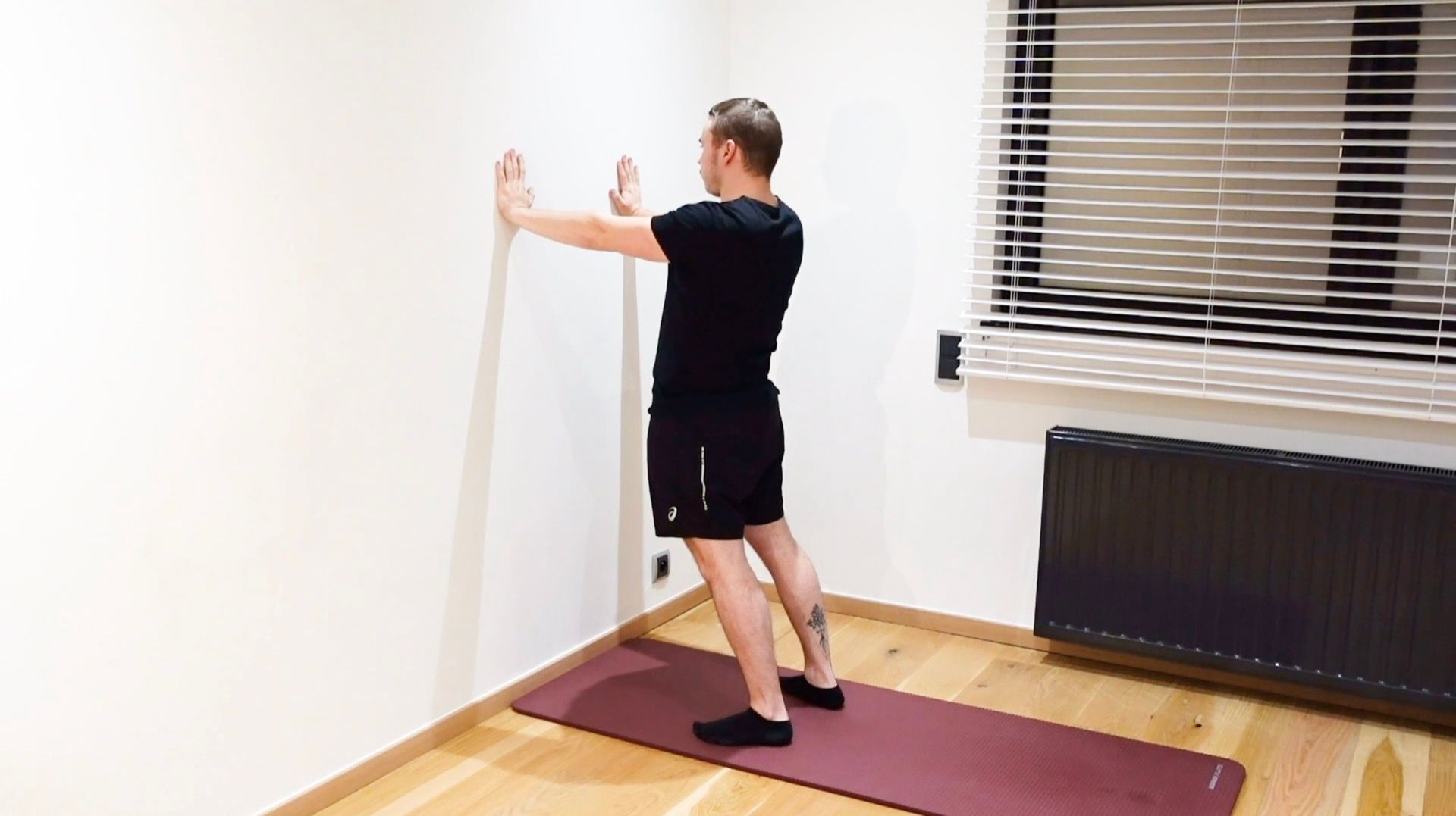 Active Extension Mobilization Against Wall, view 1