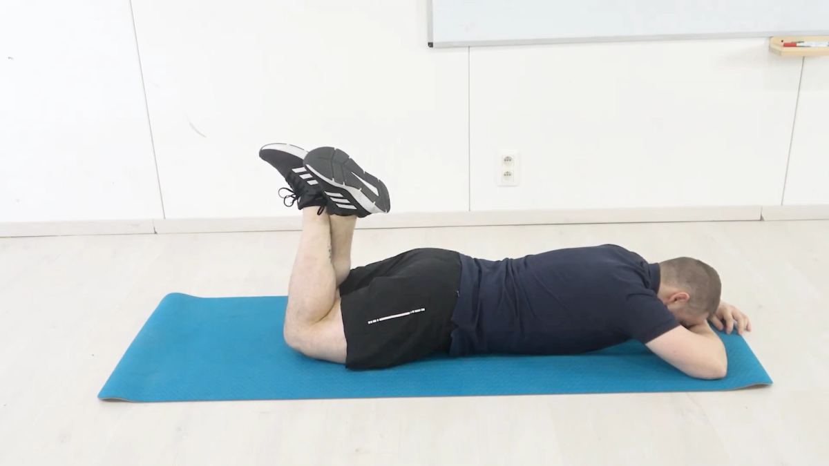 Prone Knee Flexion Assisted by Opposite Leg