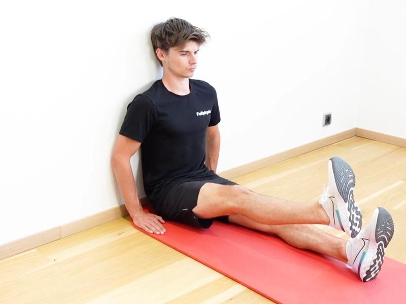 Hip Flexor Strengthening Seated Against a Wall, view 2