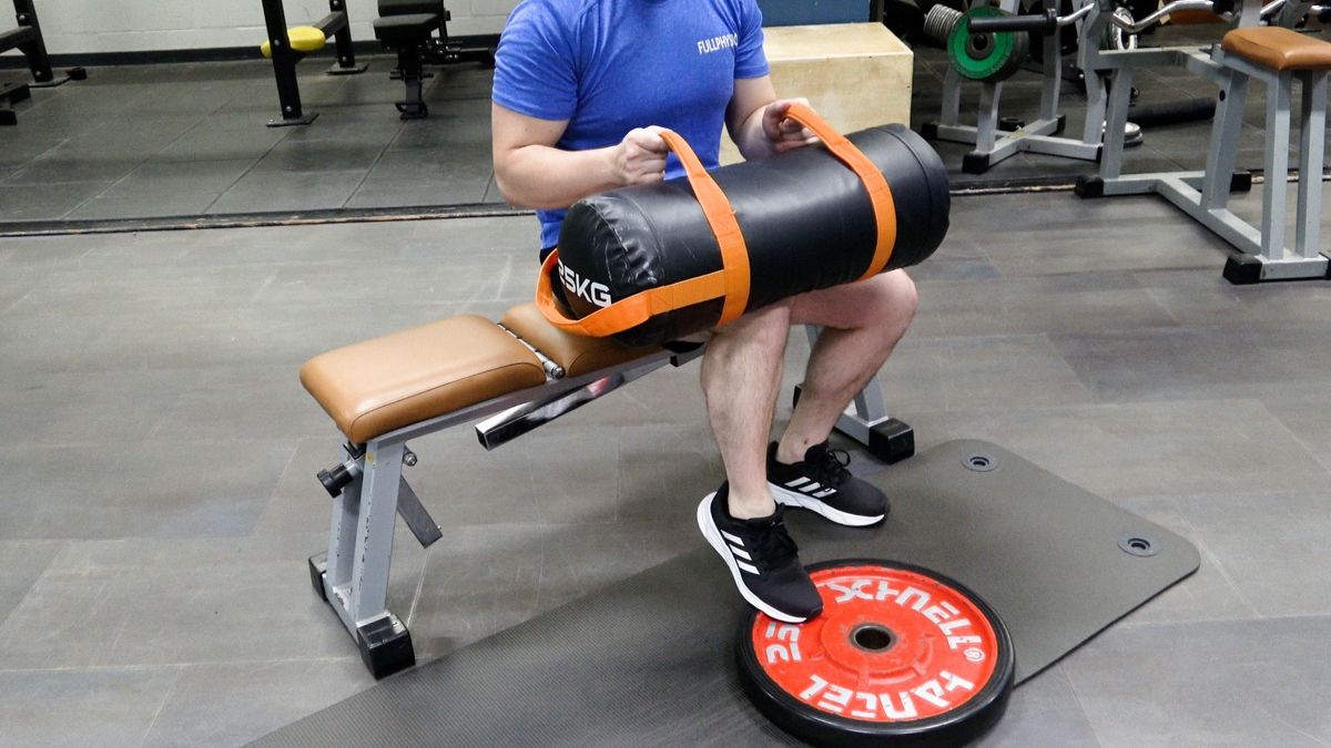 Seated Heel Raises With Weighted Bag