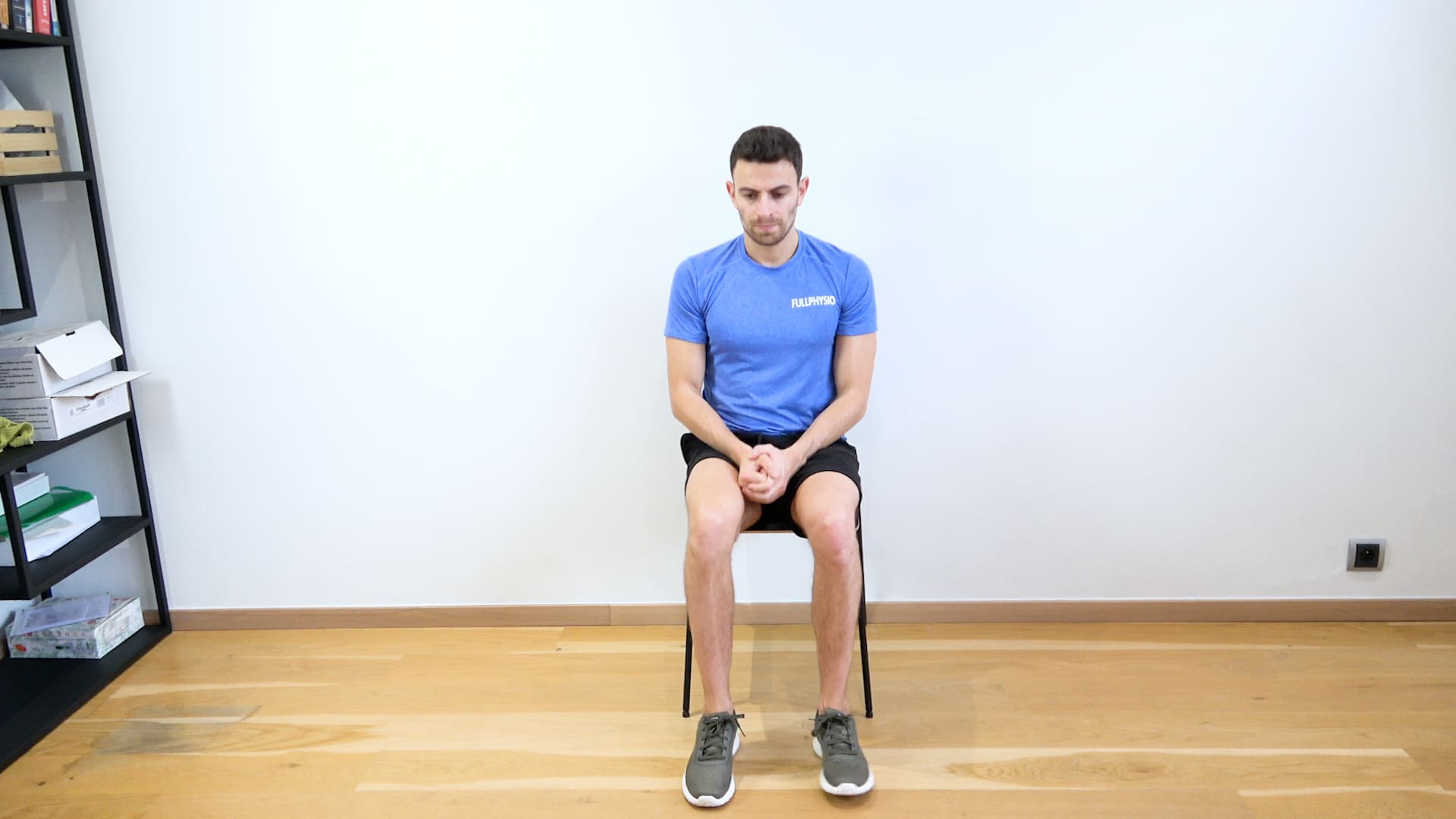Glute Self-Stretching on a Chair, view 1