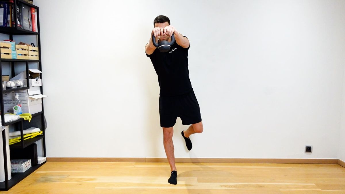 Single-Leg Balance With Kettlebell From One Hand to the Other