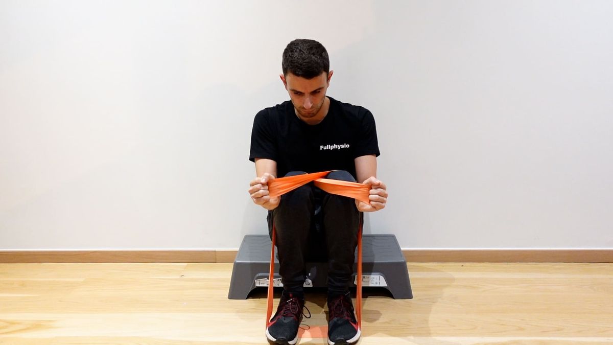 Wrist Extension Strengthening With Crossed Band Under Feet