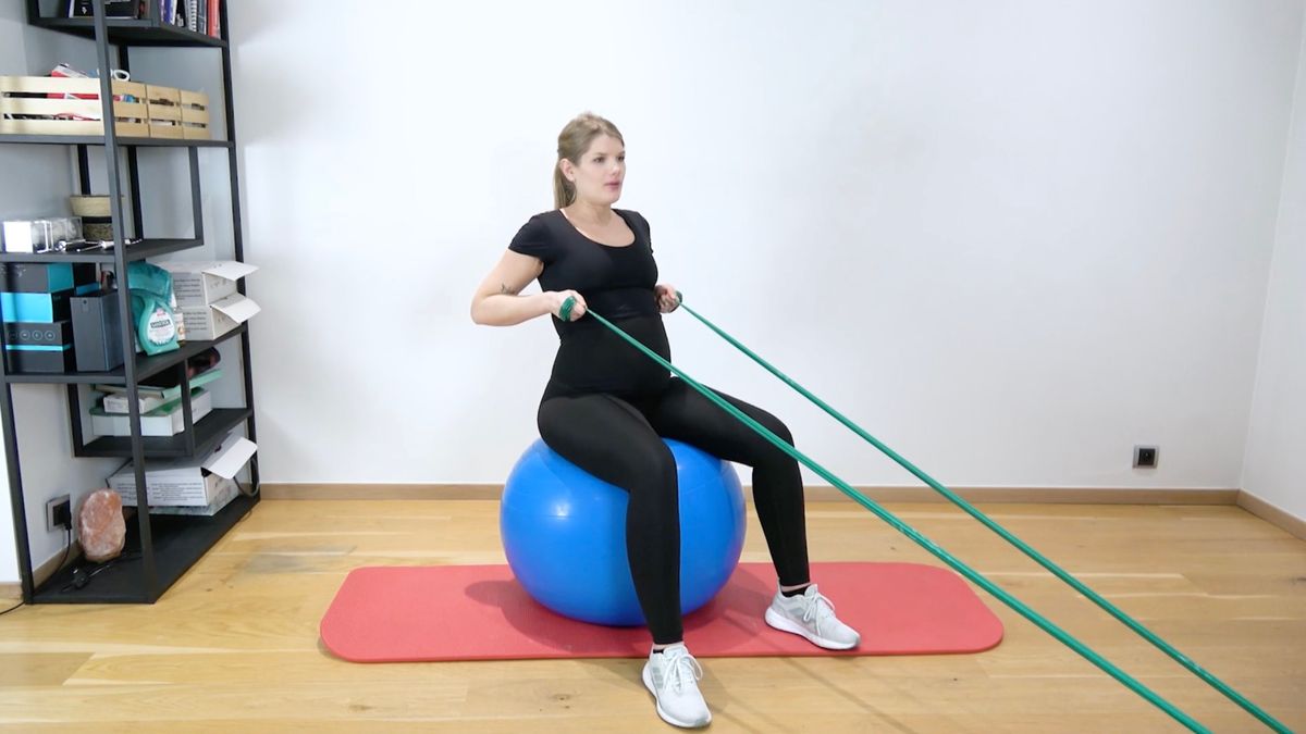 Rowing Exercise With Elastic Band on Swiss Ball