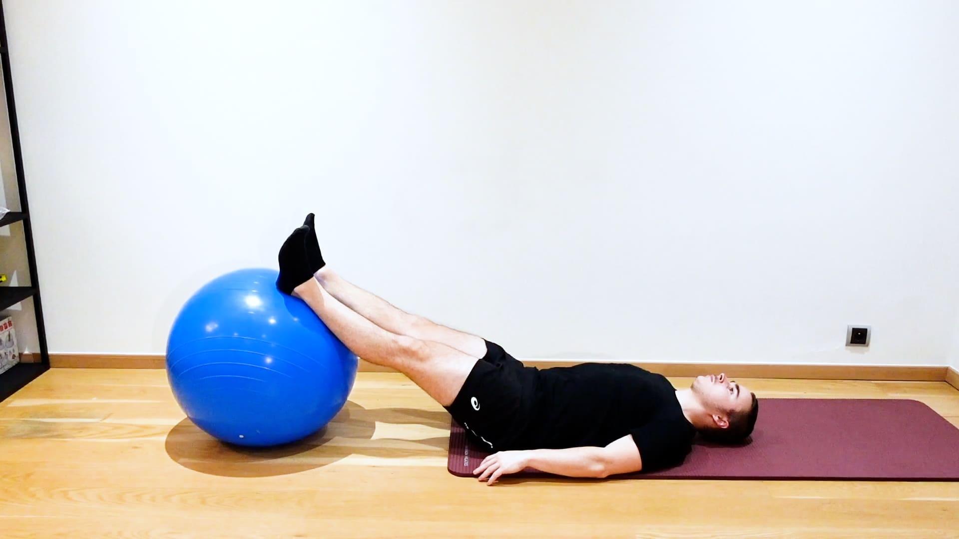 Lumbar Flexion With Swiss Ball, view 1