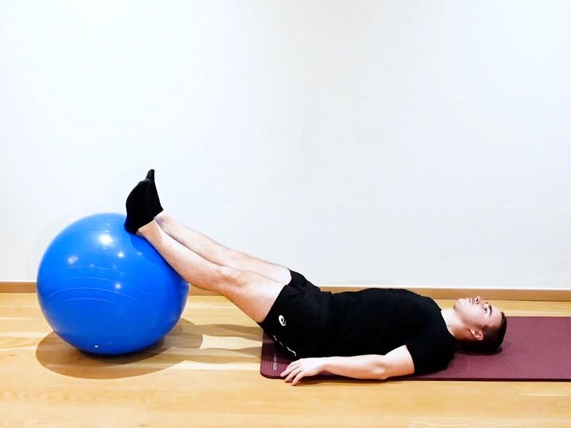 Lumbar Flexion With Swiss Ball, view 1