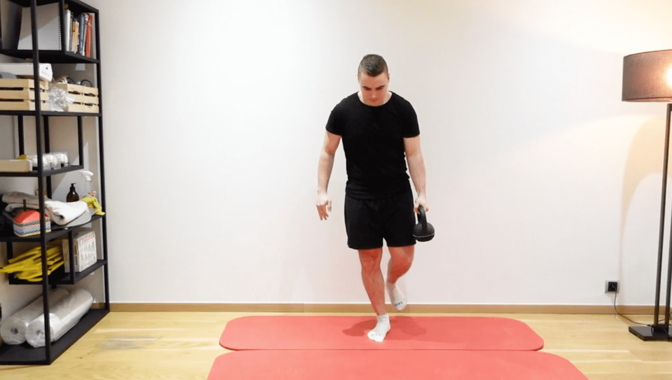 Single-Leg Balance With Kettlebell Transfer, view 1