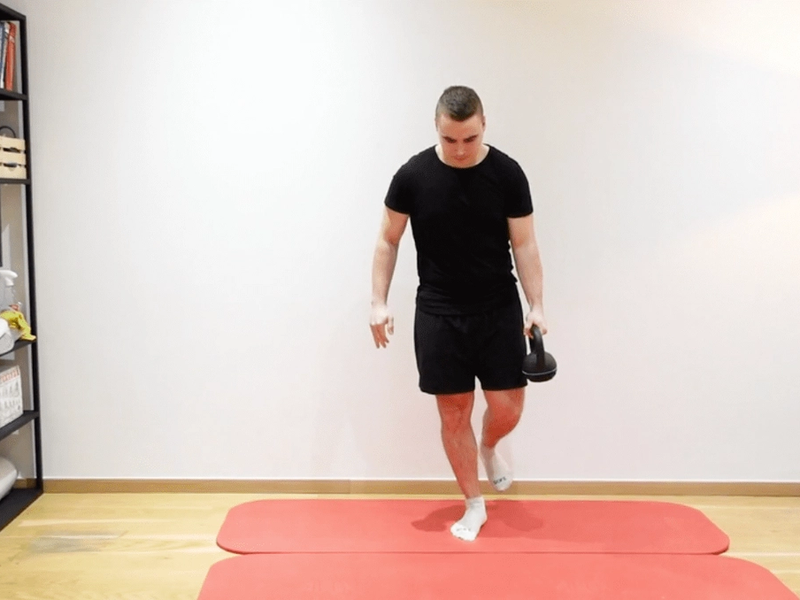Single-Leg Balance With Kettlebell Transfer, view 1