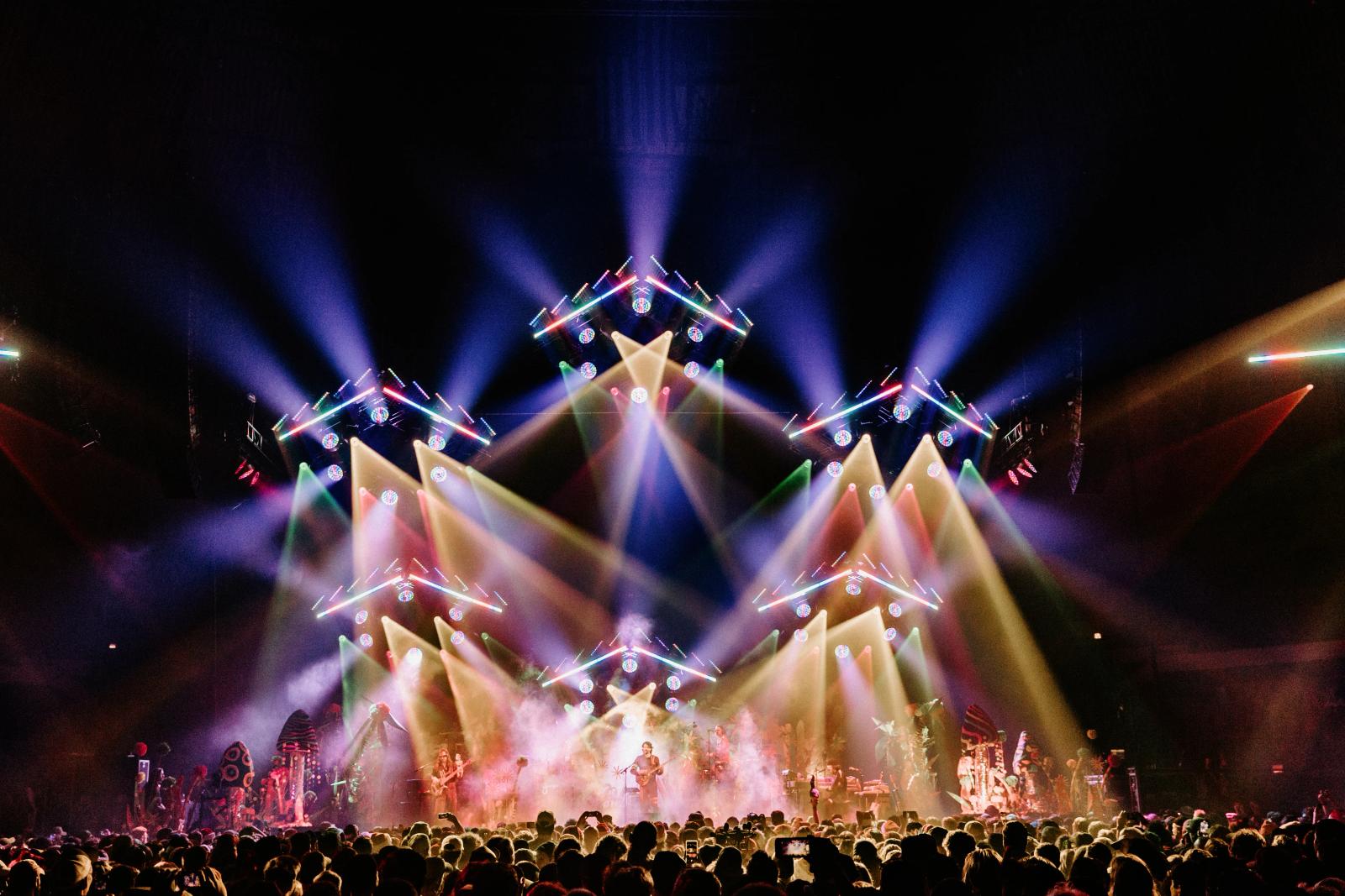 Stage lighting and haze at a modern metal show