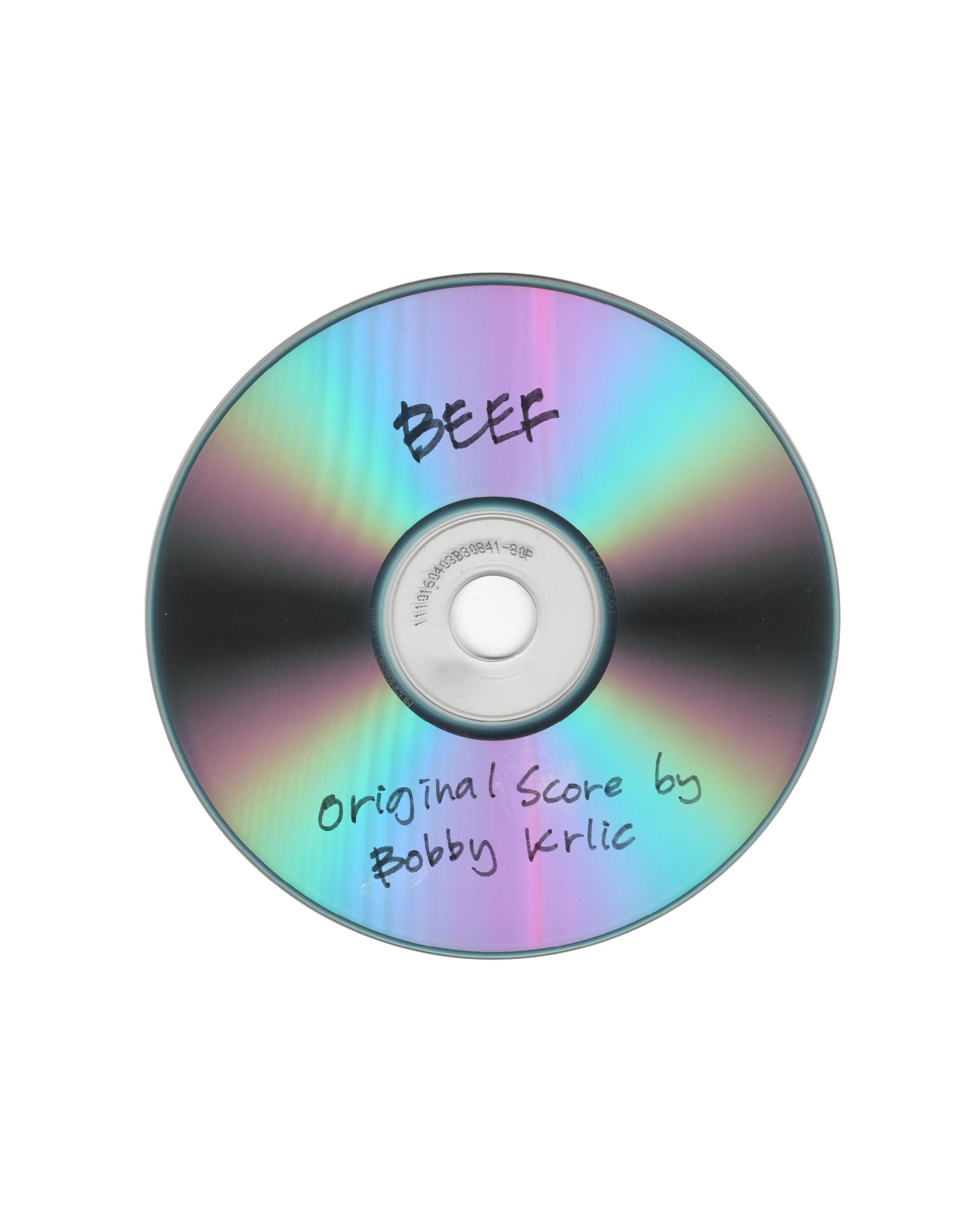 "Beef" OST iridescent CD disc: "BEEF / Original Score by Bobby Krlic" handwritten in marker, white bg
