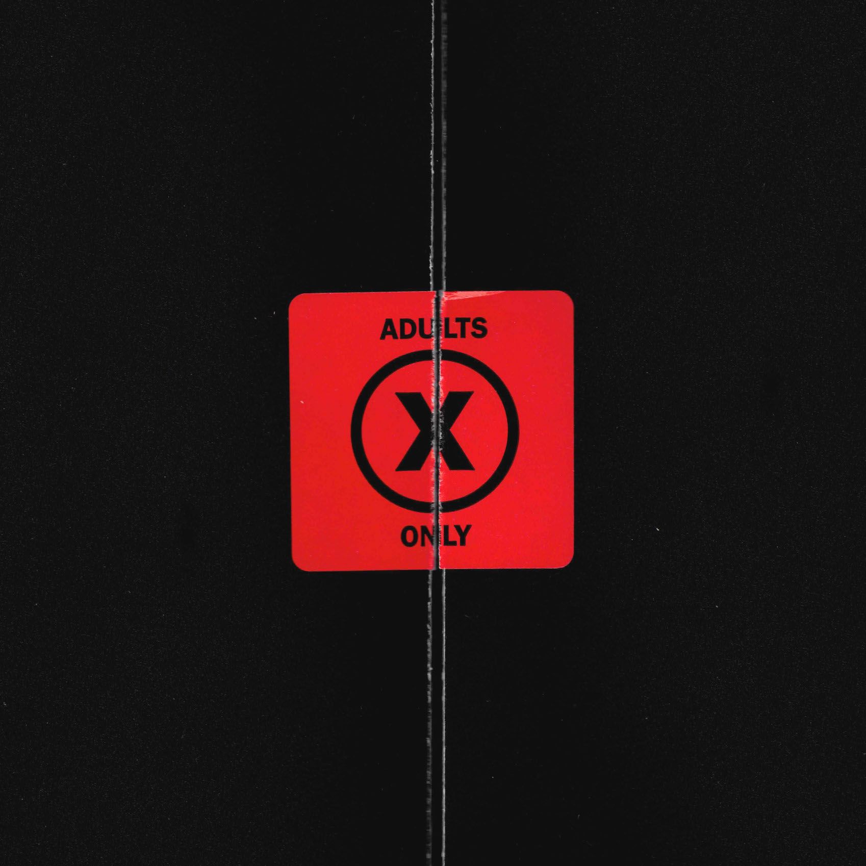 "X" OST red "ADULTS ONLY" sticker close-up: bold black X in circle, square sticker sealed on black poly sleeve