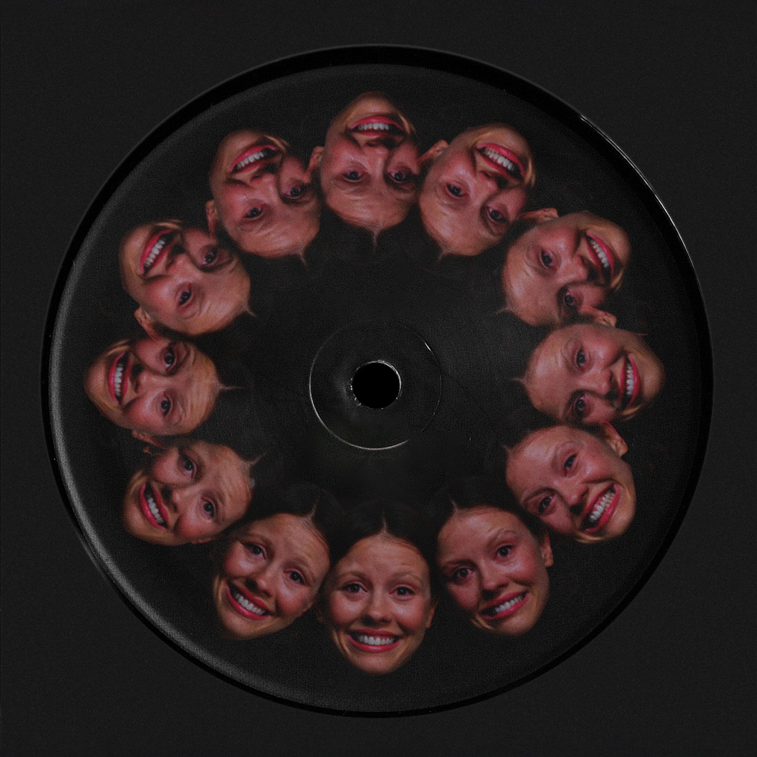 12 repeating smiling faces from "Pearl" ending, encircling center hole on black vinyl