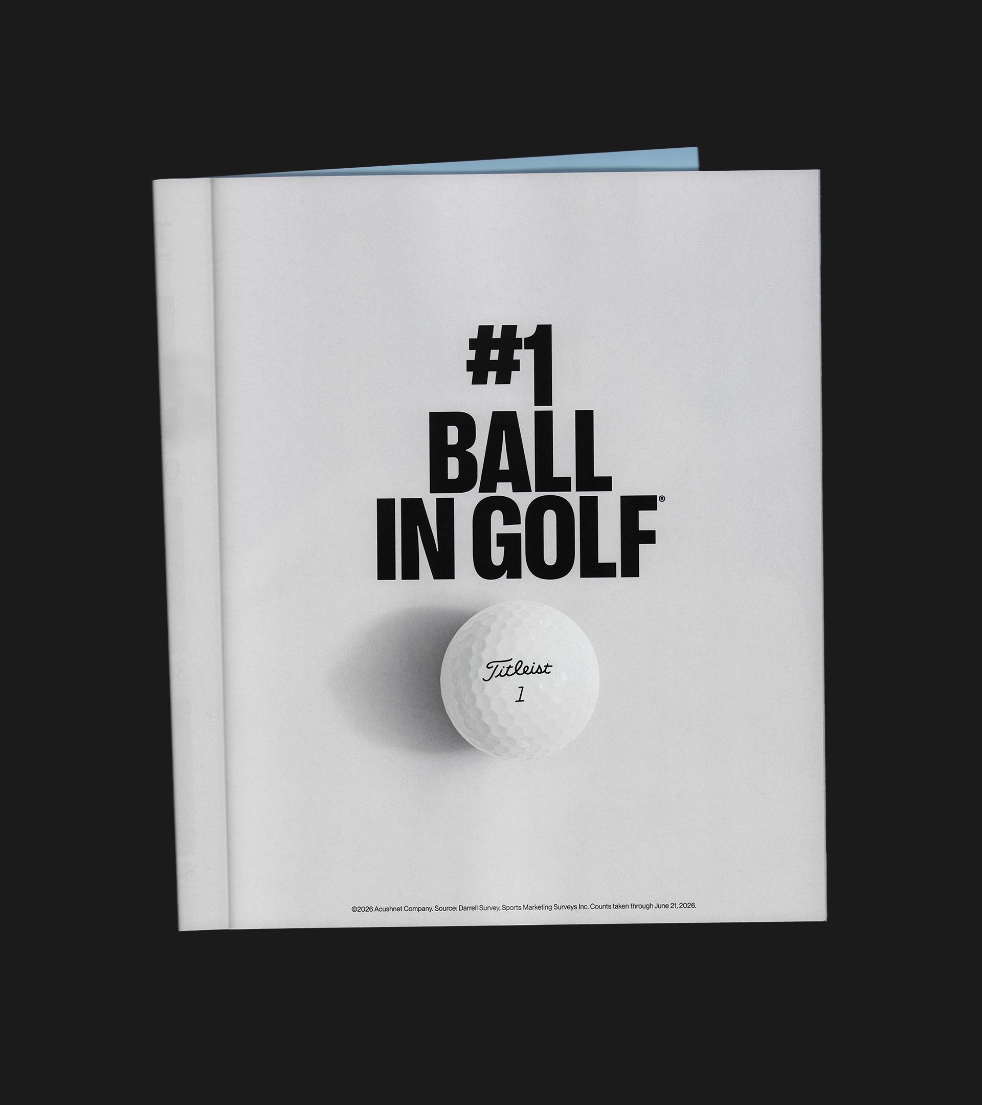 Printed magazine ad with “#1 Ball in Golf” in heavy black type above a white Titleist golf ball on a light gray page.