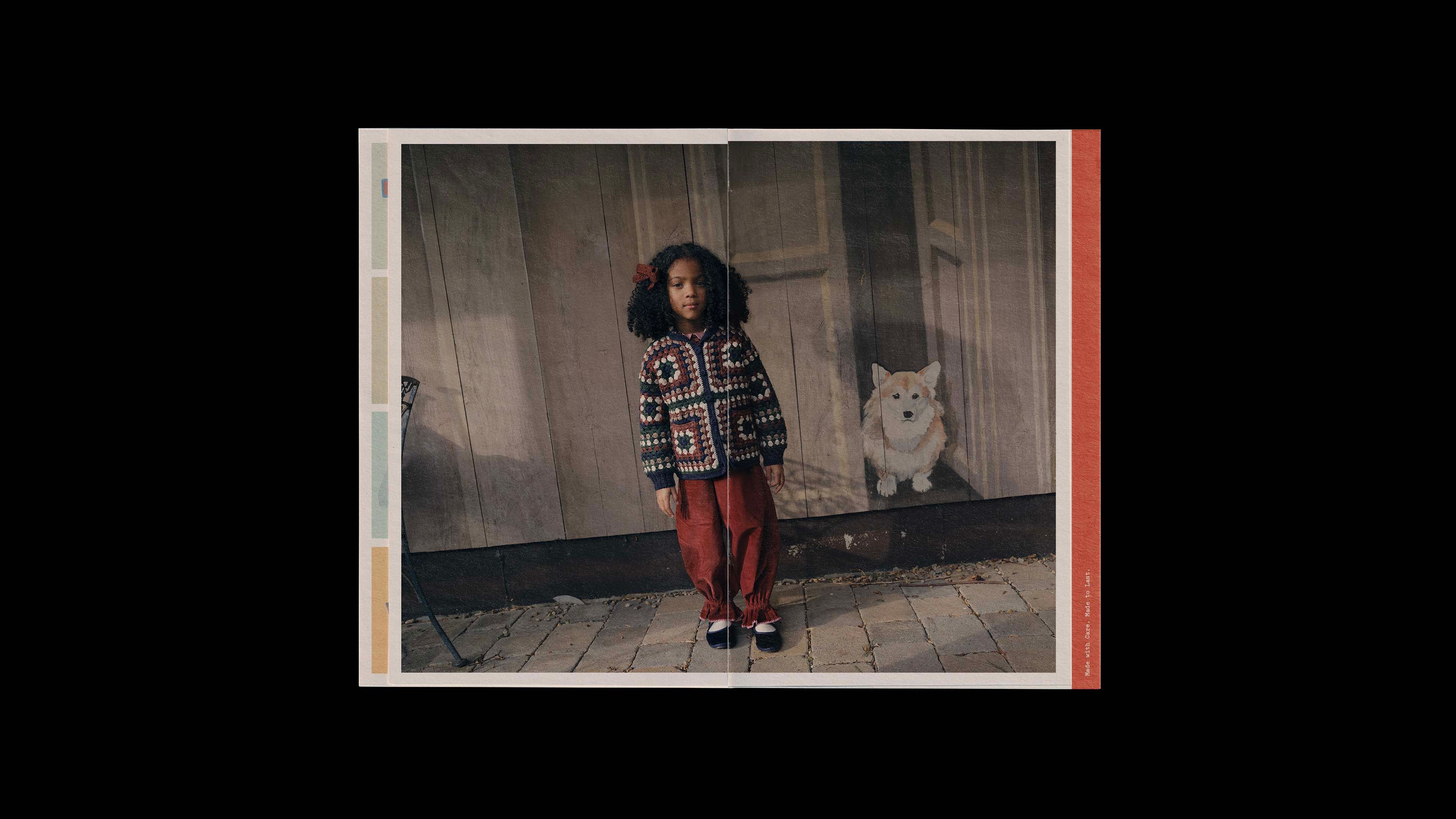 Misha & Puff catalog spread: full bleed photo of a child in a granny-square crochet jacket and rust pants with a corgi painted in the background.